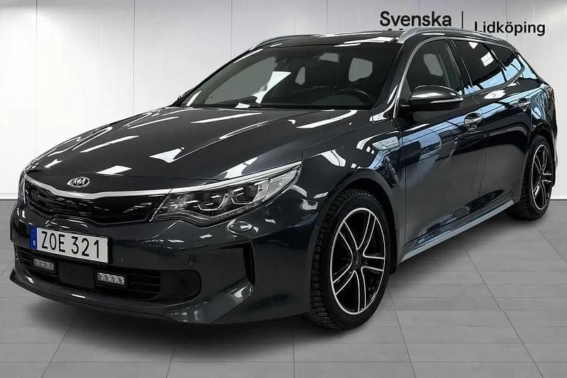 Grå Begagnad 2018 Kia Optima Hybrid Sport Sedan | 169 900 kr (Marknadspris) - Bild 1/4
