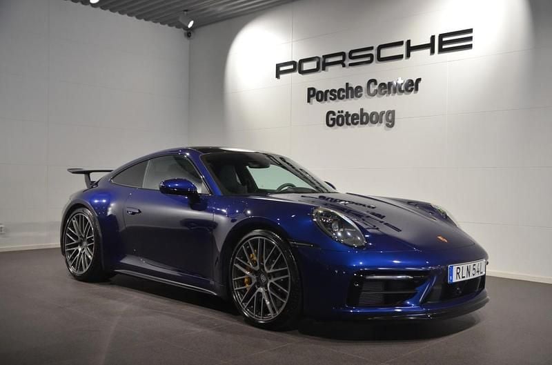Mörkblå (blue) Begagnad 2021 Porsche 911 Carrera 4S Sportkupé | 1 690 000 kr - Bild 1/4