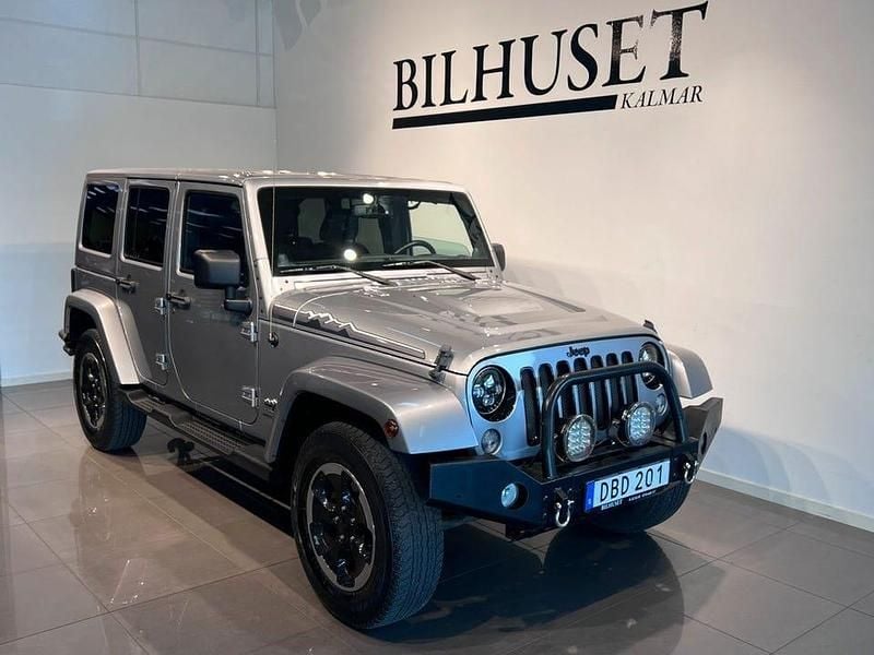 Grå Begagnad 2014 Jeep Wrangler Unlimited SUV | 309 900 kr (Marknadspris) - Bild 1/4