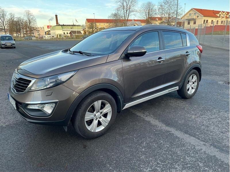 Brun Begagnad 2013 Kia Sportage EX SUV | 69 800 kr (Bra pris) - Bild 1/4