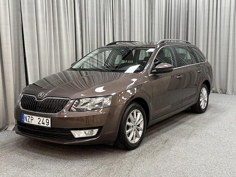 Mörkbrun Begagnad 2013 Skoda Octavia Ambition Kombi | 149 900 kr (Bra pris) - Bild 1/4