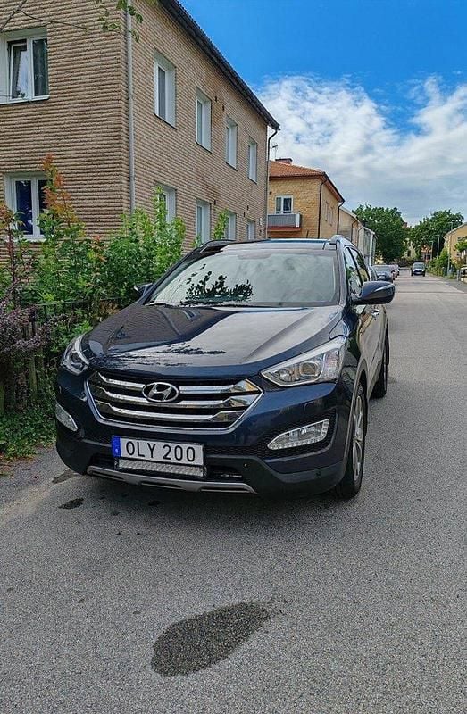 Blå Begagnad 2014 Hyundai Santa Fe Premium SUV | 129 000 kr (Marknadspris) - Bild 1/4