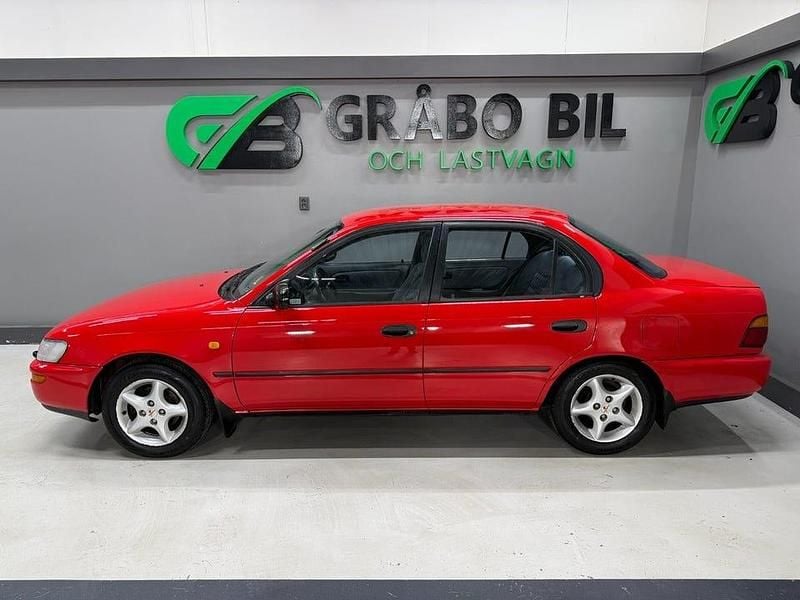 Begagnad Toyota Corolla 114 HK (83 kW) 1996 Röd Sedan