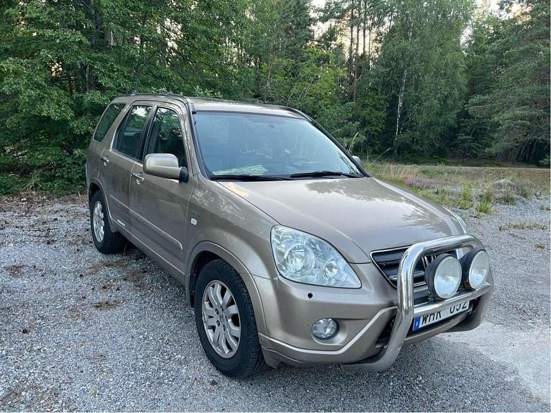Brun Begagnad 2005 Honda CR-V SUV | 30 000 kr (Marknadspris) - Bild 1/4