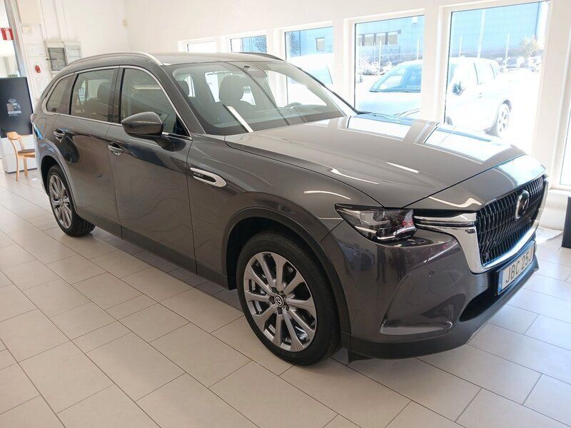 Grå Ny 2024 Mazda CX-80 Exclusive-Line SUV | 597 900 kr (Superpris) - Bild 1/4