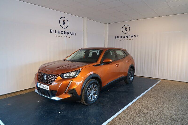 Orange (orange fusion) Begagnad 2021 Peugeot e-2008 Active SUV | 194 800 kr (Marknadspris) - Bild 1/4