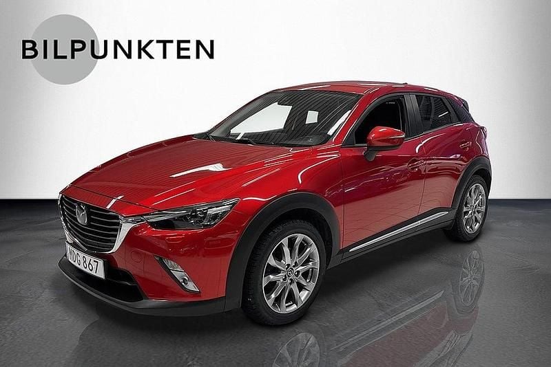 Rödmetallic Begagnad 2015 Mazda CX-3 Optimum SUV | 129 900 kr (Marknadspris) - Bild 1/4