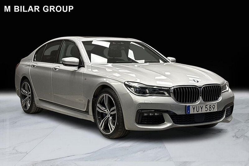 Silver Begagnad 2017 BMW 750 M Sport Sedan | 479 000 kr - Bild 1/4