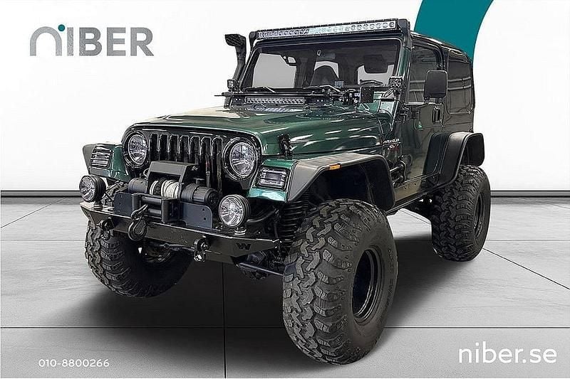 Mörkgrön Begagnad 1998 Jeep Wrangler Sahara SUV | 249 900 kr - Bild 1/4