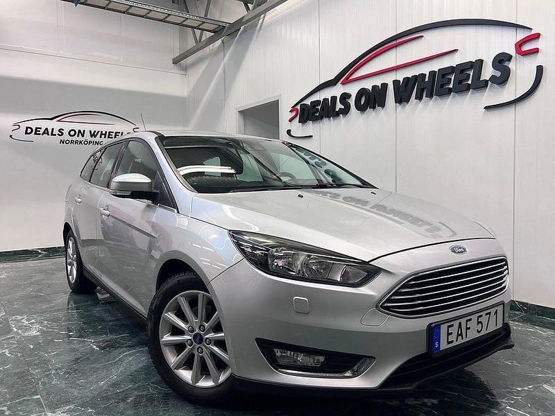 Grå Begagnad 2014 Ford Focus Titanium Kombi | 64 900 kr (Marknadspris) - Bild 1/4