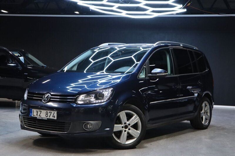 Mörkblå (blå) Begagnad 2012 VW Touran GT Minibuss | 119 900 kr - Bild 1/4