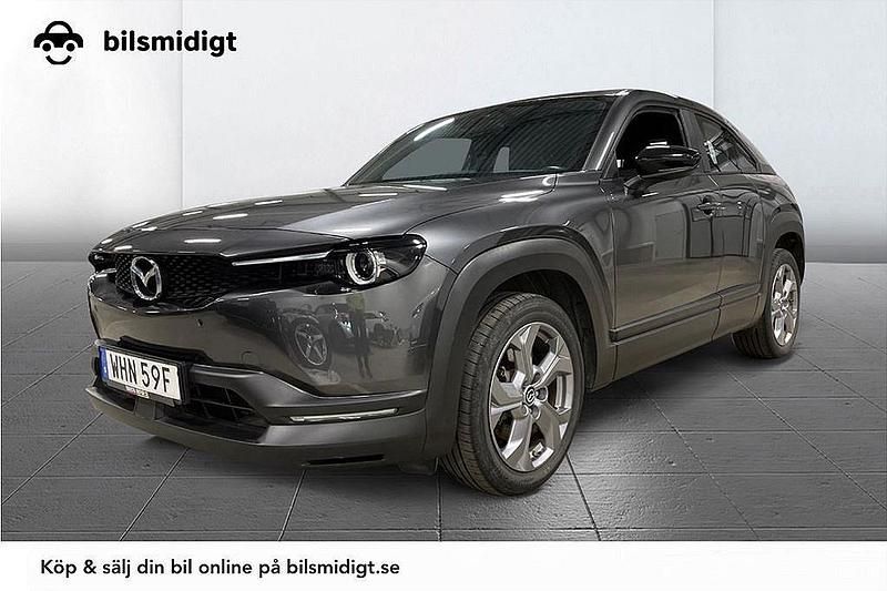 Grå Begagnad 2021 Mazda MX30 Cosmo SUV | 159 700 kr (Marknadspris) - Bild 1/3