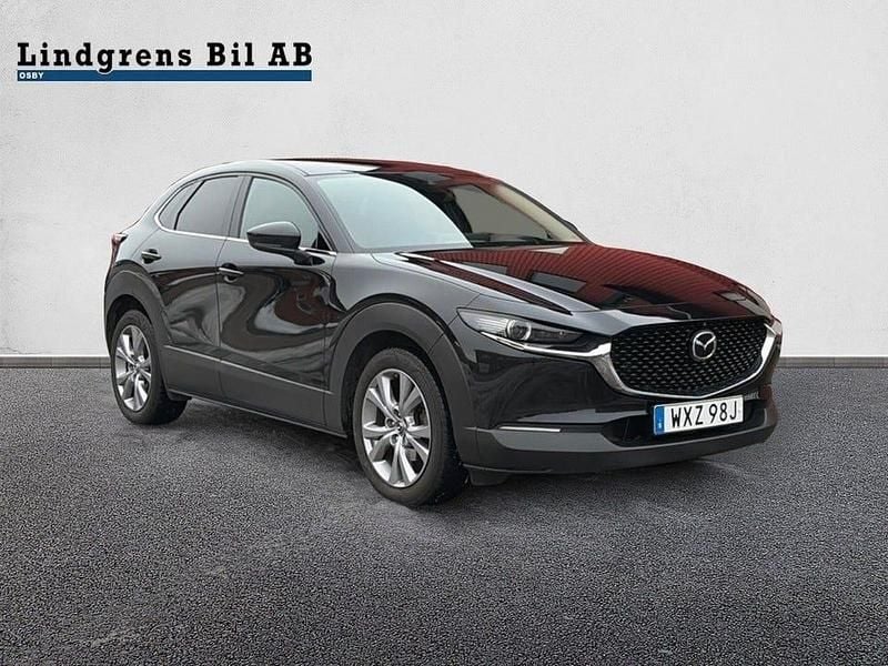 Svart metallic Begagnad 2020 Mazda CX-30 Cosmo SUV | 209 900 kr (Marknadspris) - Bild 1/4