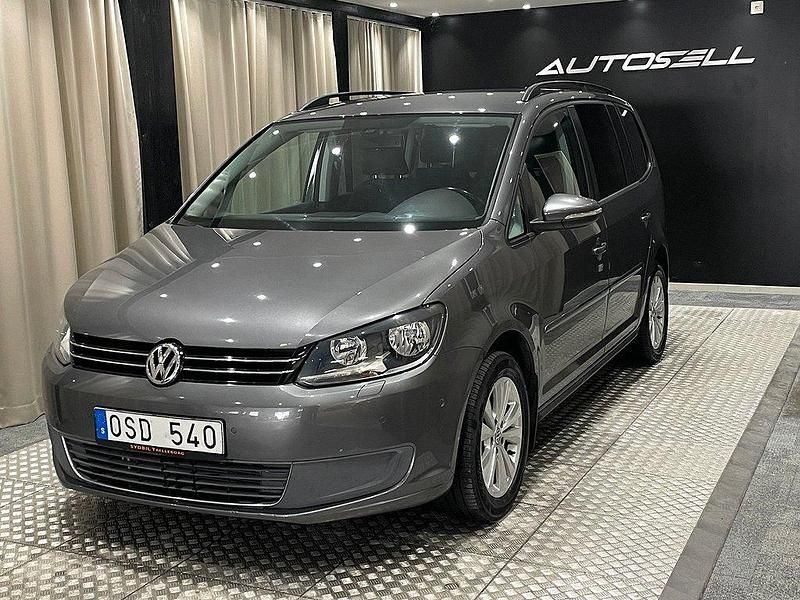 Mörkgrå (grå) Begagnad 2011 VW Touran Minibuss | 79 900 kr (Dyr) - Bild 1/4