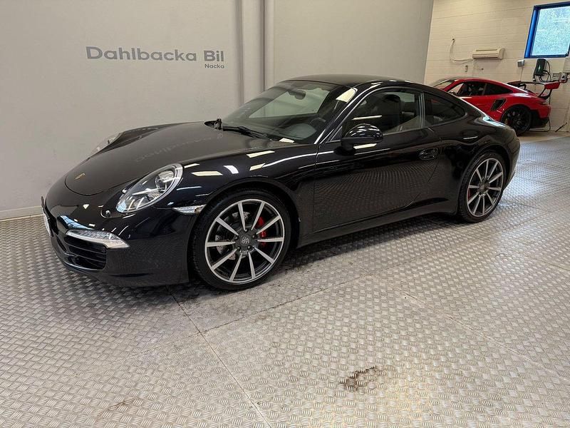 Svart Begagnad 2012 Porsche 911 Carrera Sportkupé | 750 000 kr - Bild 1/4