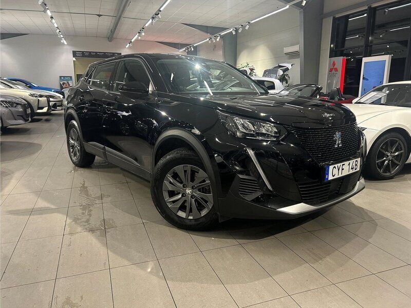 Svart Begagnad 2021 Peugeot e-2008 Active SUV | 189 900 kr (Marknadspris) - Bild 1/4