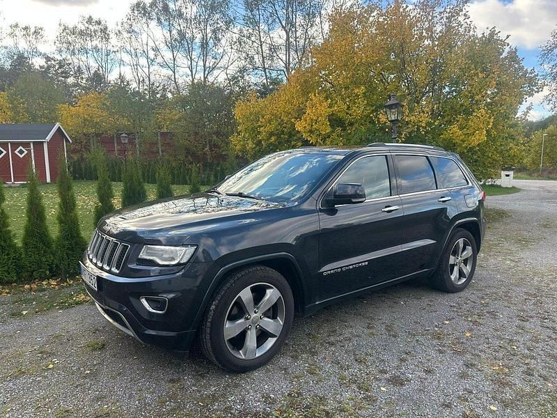 Blå Begagnad 2014 Jeep Grand Cherokee SUV | 219 500 kr (Marknadspris) - Bild 1/4