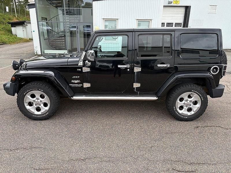 Silver Begagnad 2014 Jeep Wrangler Sahara SUV | 209 900 kr (Superpris) - Bild 1/4