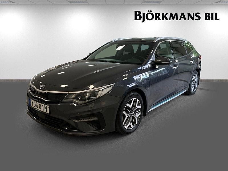 Grå (/abt/ platinum graphite) Begagnad 2020 Kia Optima Hybrid 2 Sedan | 249 900 kr (Marknadspris) - Bild 1/4