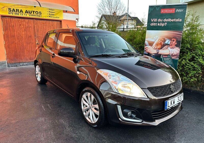 Brun Begagnad 2014 Suzuki Swift Halvkombi | 61 900 kr (Marknadspris) - Bild 1/4