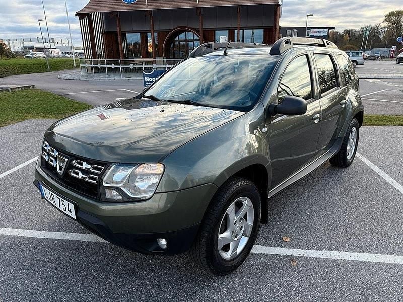 Grå Begagnad 2013 Dacia Duster SUV | 89 900 kr (Marknadspris) - Bild 1/4