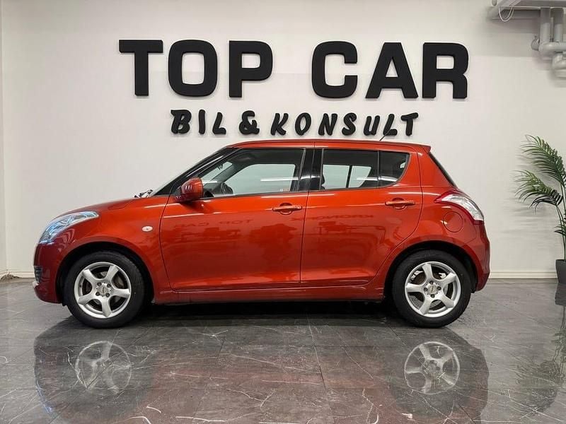 Begagnad Suzuki Swift 94 HK (69 kW) 2011 Orange Halvkombi