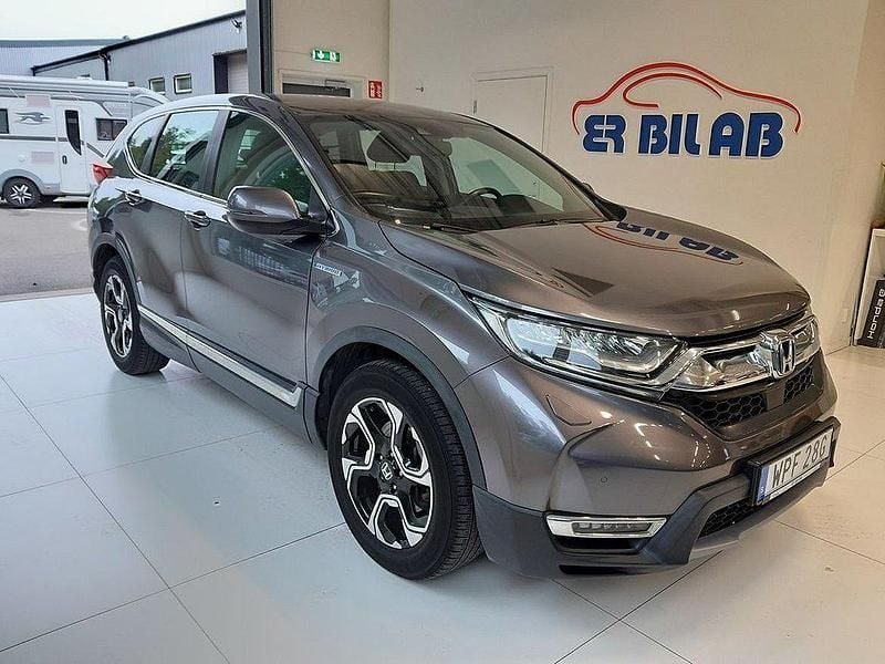 Ljusgrå Begagnad 2019 Honda CR-V Hybrid SUV | 269 900 kr (Marknadspris) - Bild 1/4