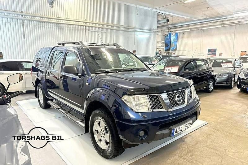Blå Begagnad 2007 Nissan Navara Pickup | 74 900 kr (Marknadspris) - Bild 1/3