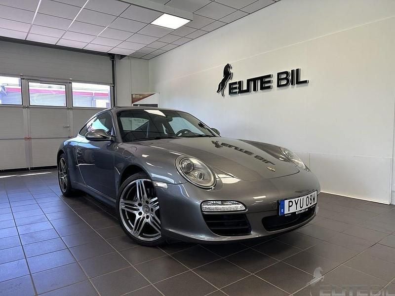 Meteor grå metallic Begagnad 2009 Porsche 911 Carrera Sportkupé | 599 900 kr - Bild 1/4