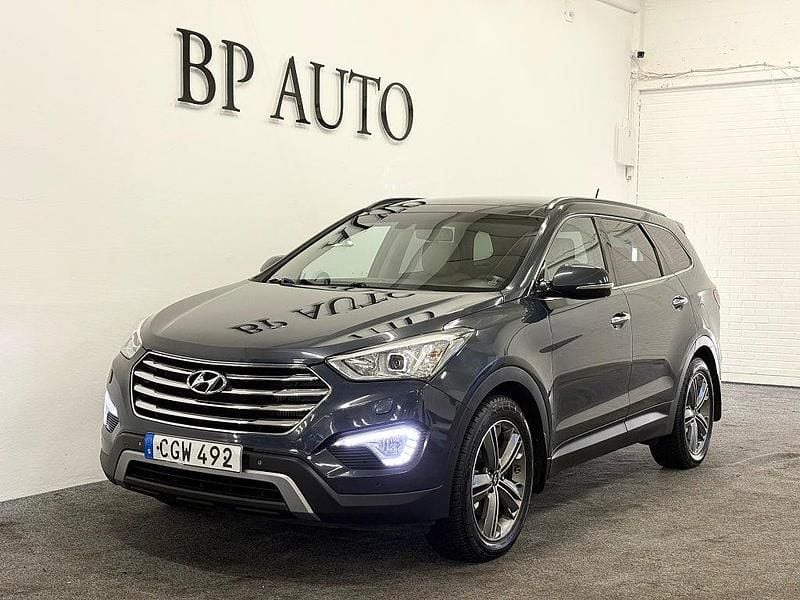 Blå Begagnad 2014 Hyundai Grand Santa Fe Premium SUV | 149 900 kr (Marknadspris) - Bild 1/4