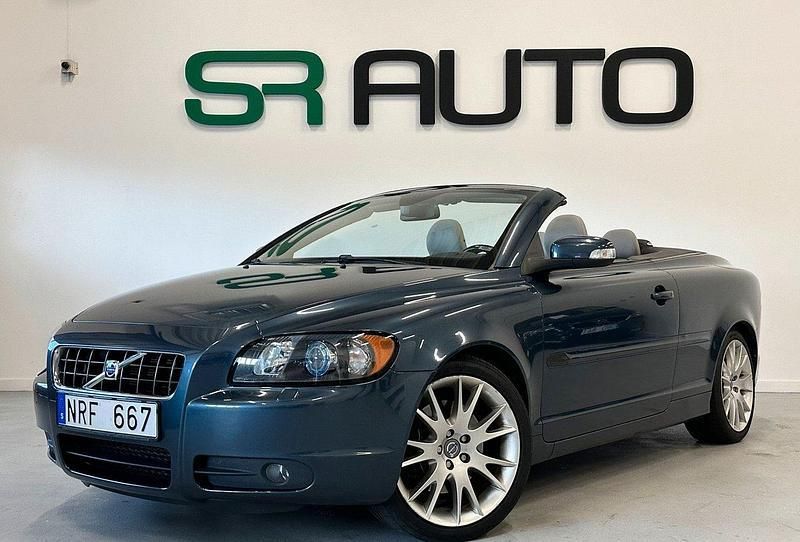 Mörkblå Begagnad 2009 Volvo C70 Summum Cab | 159 900 kr (Marknadspris) - Bild 1/4