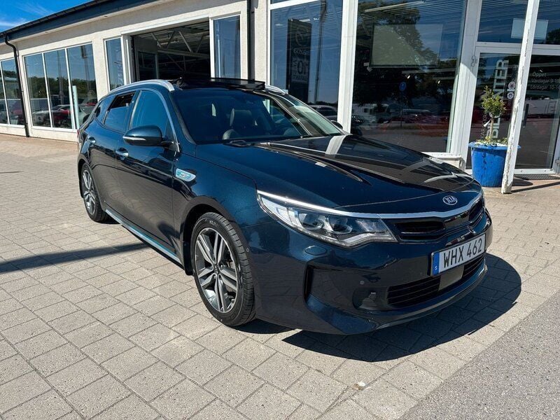Blå (gravity blue) Begagnad 2018 Kia Optima Hybrid 2 Sedan | 179 000 kr (Marknadspris) - Bild 1/4