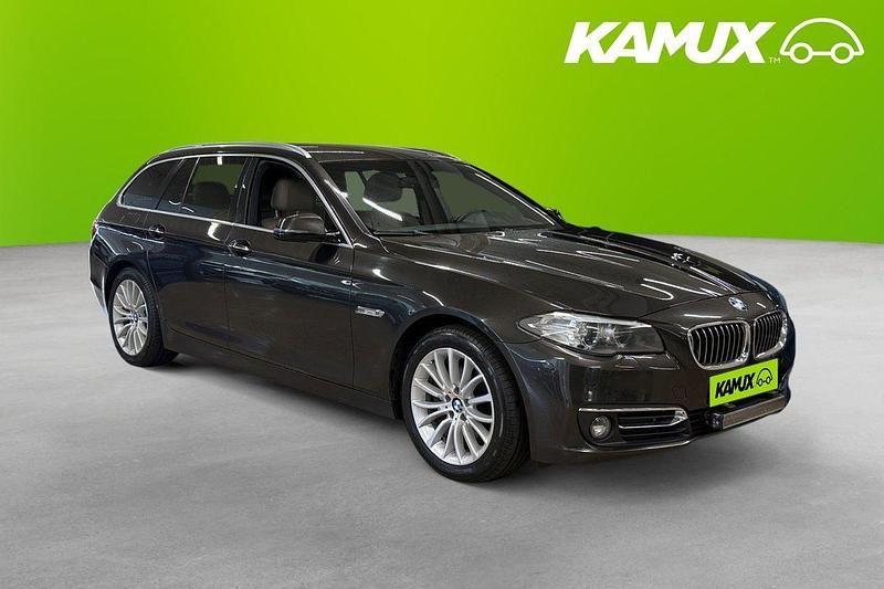 Brun Begagnad 2014 BMW 520 Luxury Line Kombi | 144 800 kr (Marknadspris) - Bild 1/4