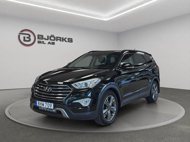 Svart Begagnad 2014 Hyundai Grand Santa Fe Premium SUV | 178 500 kr (Marknadspris) - Bild 1/4
