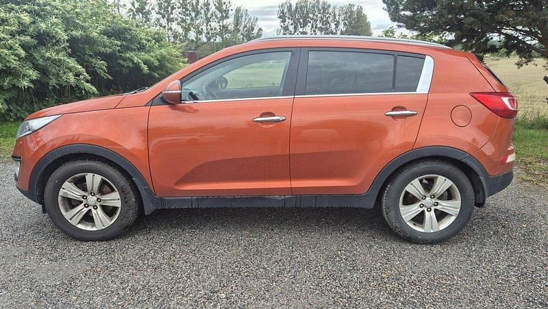 Orange Begagnad 2012 Kia Sportage SUV | 56 000 kr (Marknadspris) - Bild 1/4
