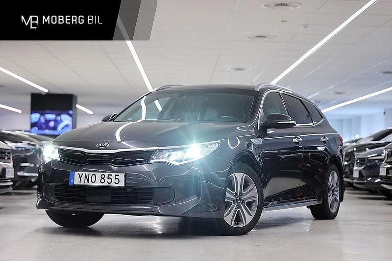 Grå Begagnad 2018 Kia Optima Hybrid 2 Sedan | 159 900 kr (Marknadspris) - Bild 1/3