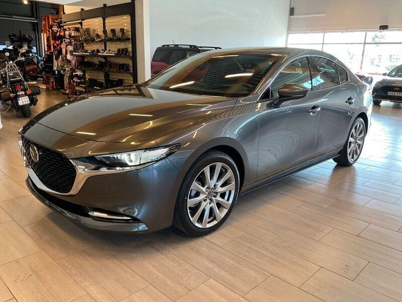 Grå Ny 2024 Mazda 3 Exclusive-Line Sedan | 368 000 kr - Bild 1/4