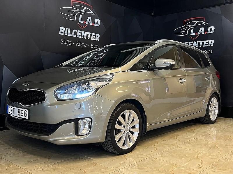 Grå Begagnad 2013 Kia Carens Minibuss | 75 900 kr (Bra pris) - Bild 1/4