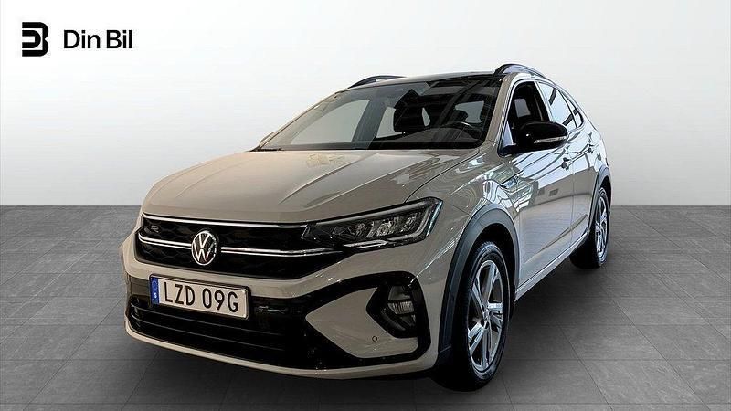 Grå (ascot grey deep black pea) Begagnad 2022 VW Taigo IQ Drive SUV | 234 900 kr (Marknadspris) - Bild 1/4