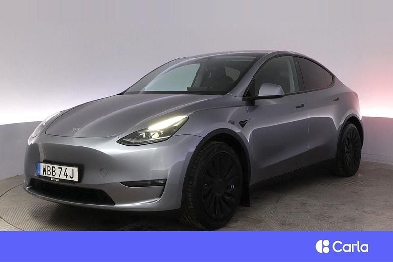 Grå Begagnad 2023 Tesla Model Y Long Range AWD SUV | 444 900 kr (Marknadspris) - Bild 1/3