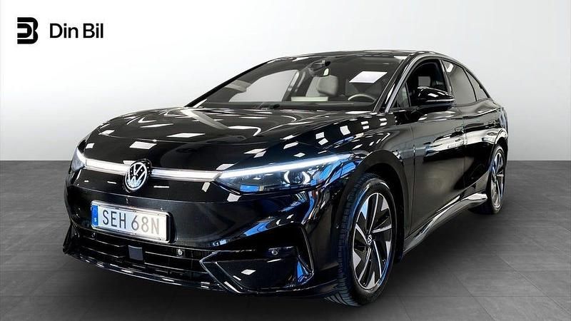 Grenadilla black metallic Begagnad 2024 VW ID.7 Comfortline Sedan | 489 800 kr (Marknadspris) - Bild 1/4