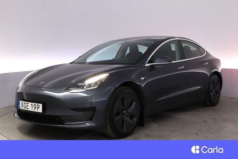 Grå Begagnad 2020 Tesla Model 3 Standard Range Plus Sedan | 245 900 kr (Bra pris) - Bild 1/4