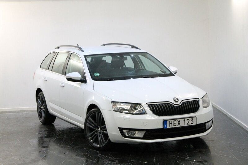 Vit Begagnad 2014 Skoda Octavia Ambition Kombi | 79 900 kr (Marknadspris) - Bild 1/4