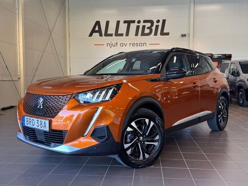 Orange Begagnad 2022 Peugeot e-2008 GT SUV | 209 900 kr (Bra pris) - Bild 1/4