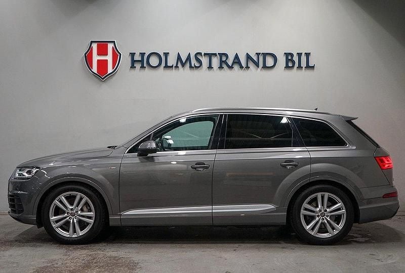 Grå Begagnad 2015 Audi Q7 S-Line SUV | 379 900 kr (Marknadspris) - Bild 1/4