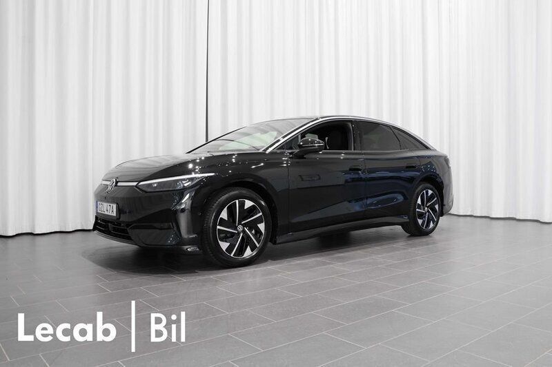 Svart (grenadilla black metallic) Begagnad 2024 VW ID.7 Pro Sedan | 499 500 kr - Bild 1/4