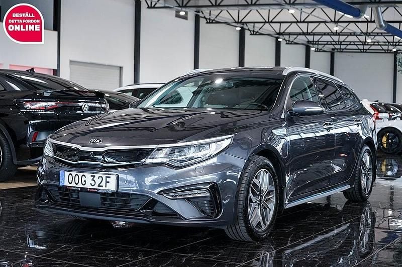 Grå Begagnad 2019 Kia Optima Hybrid Advance Sedan | 174 500 kr (Marknadspris) - Bild 1/4
