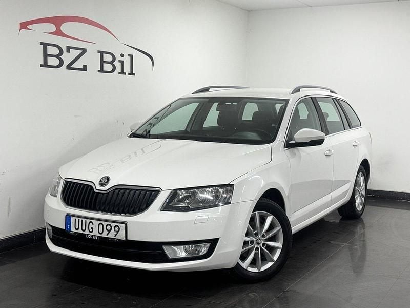 Vit Begagnad 2014 Skoda Octavia Ambition Kombi | 99 900 kr (Marknadspris) - Bild 1/4