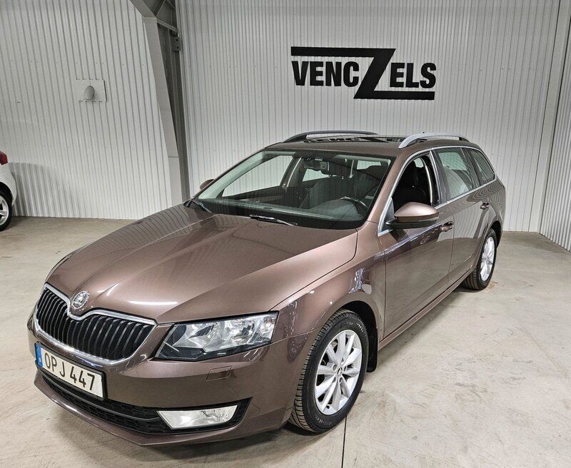 Mörkbrun Begagnad 2014 Skoda Octavia Ambition Kombi | 99 000 kr (Marknadspris) - Bild 1/4