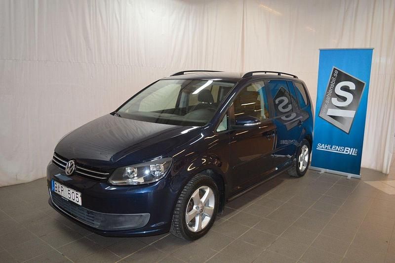 Mörkblå Begagnad 2011 VW Touran Minibuss | 98 000 kr (Marknadspris) - Bild 1/4